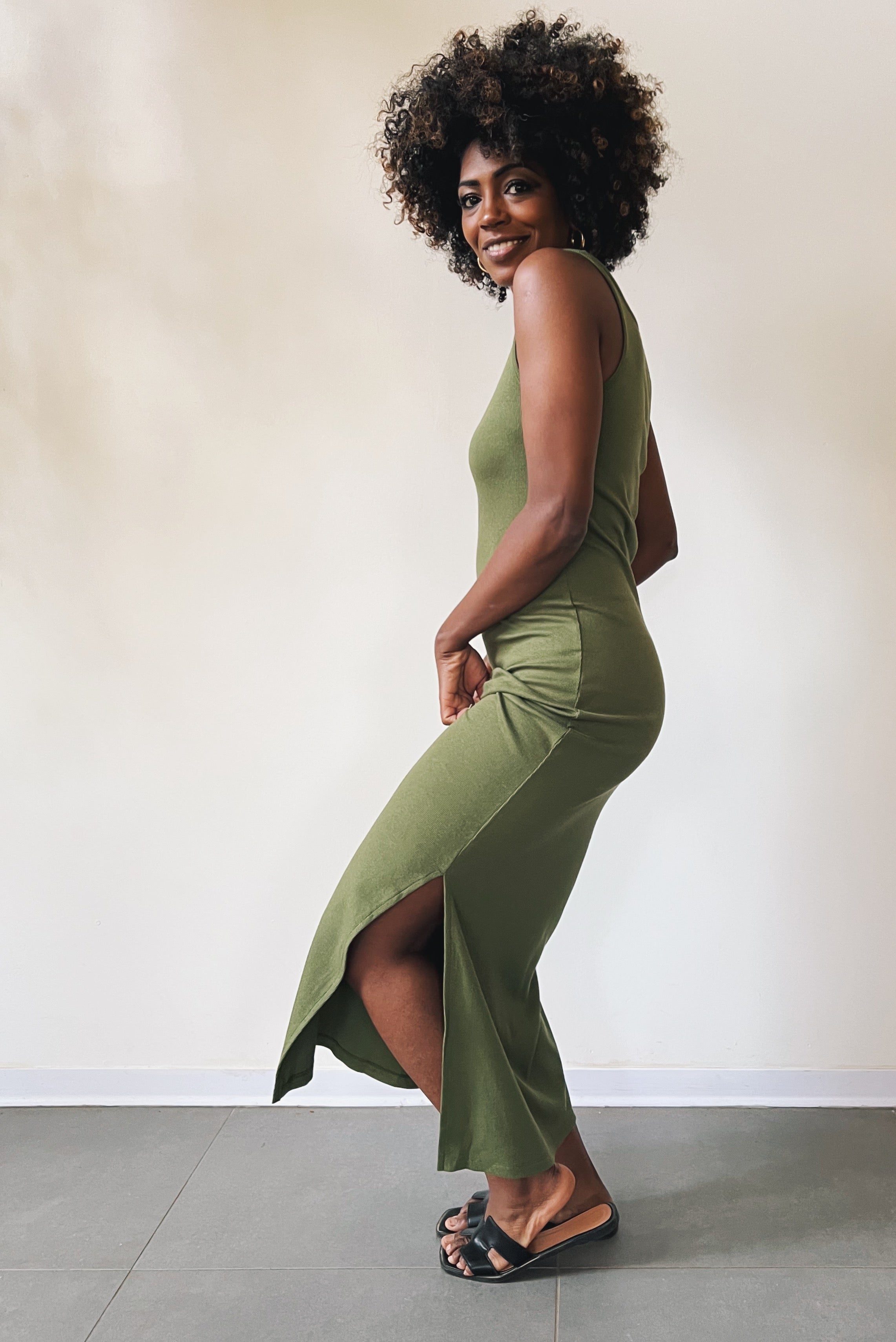 Long singlet dress with an open neckline and one side slit.