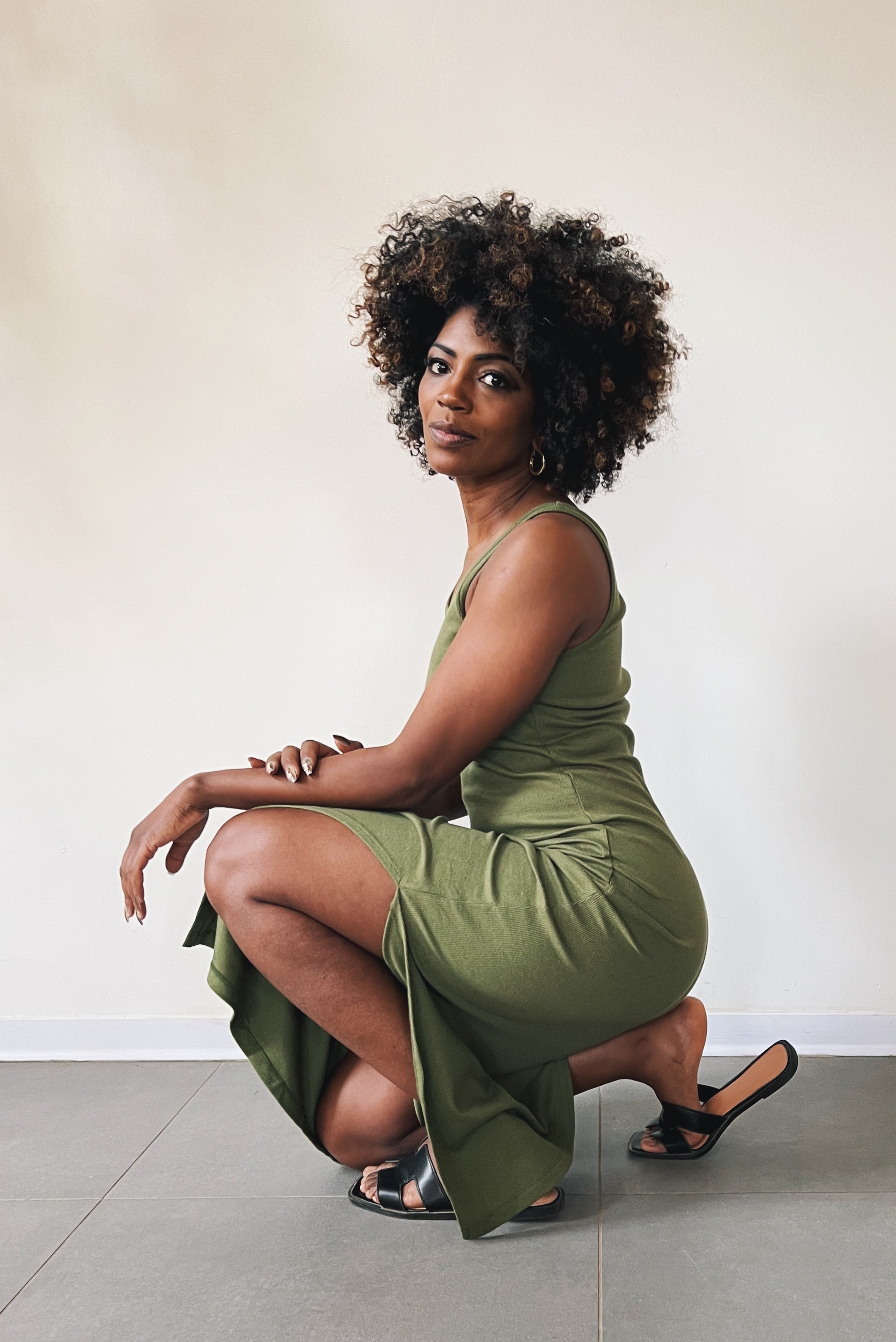 Long singlet dress with an open neckline and one side slit.