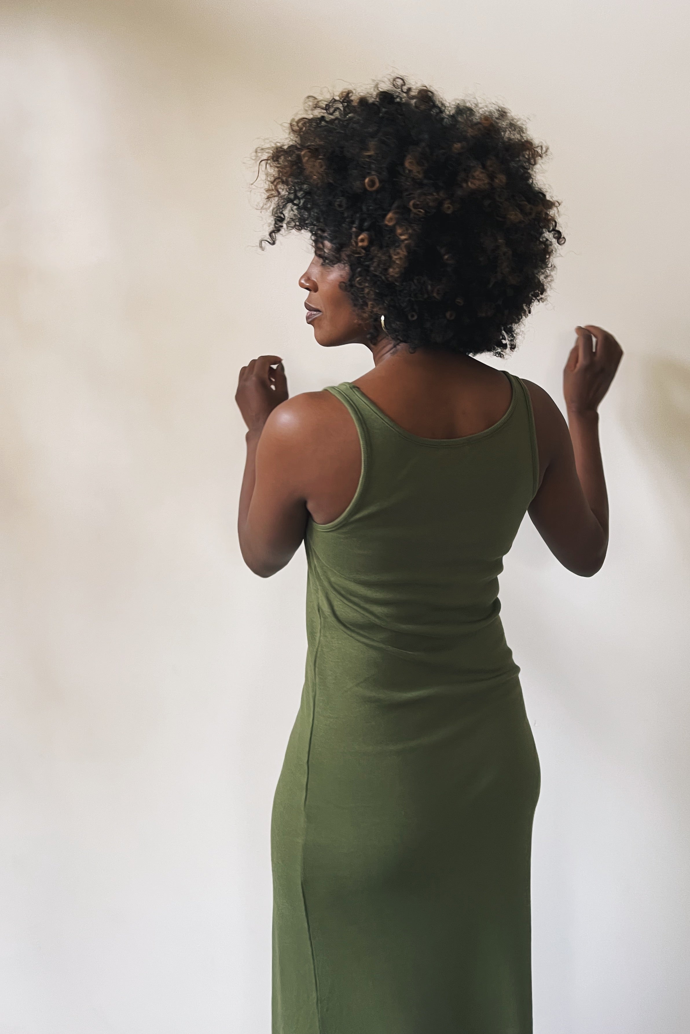 Long singlet dress with an open neckline and one side slit.